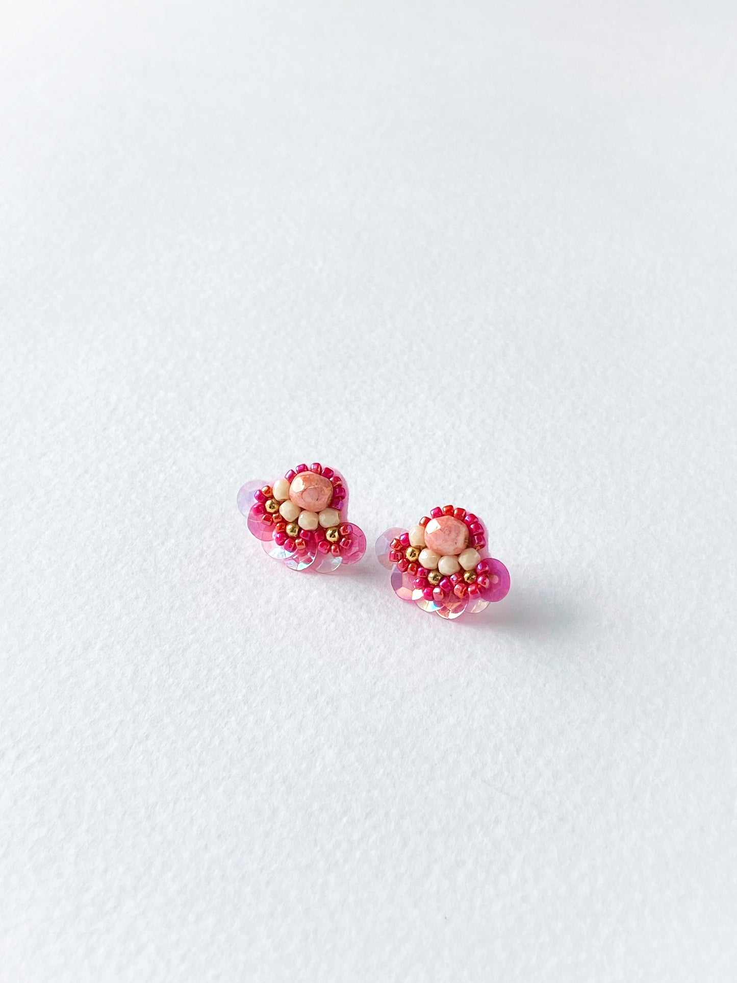Pair of pink and gold earrings