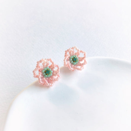 Pair of pink flower-shaped earrings